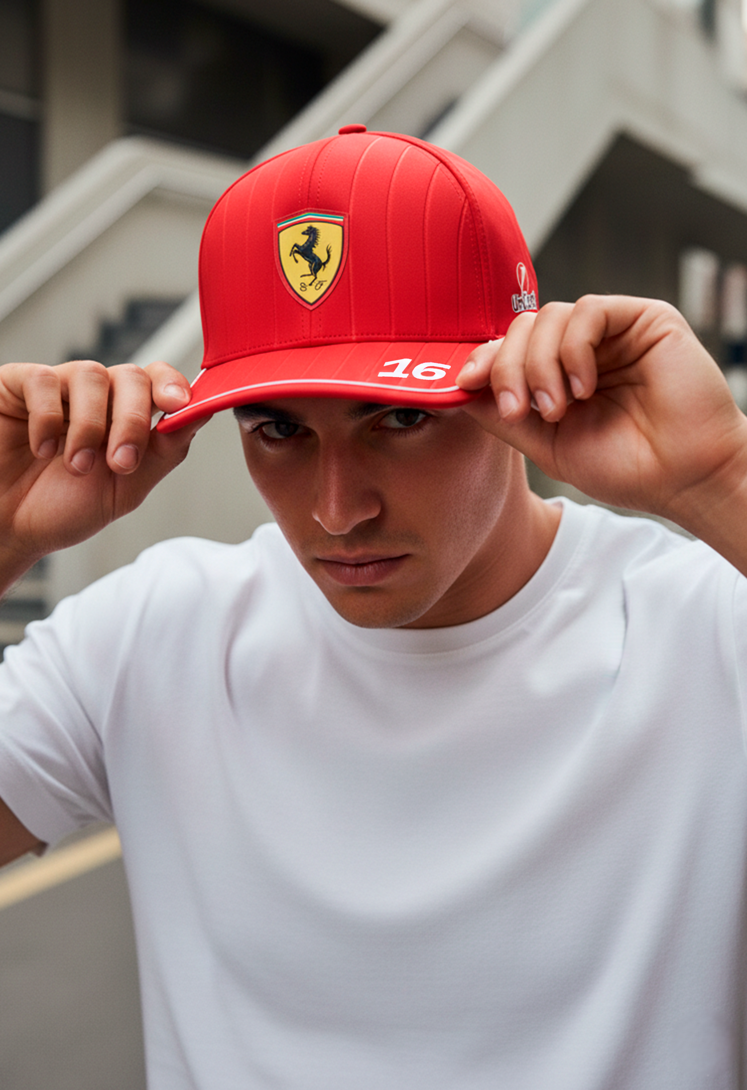 Man wearing red Ferrari Formula 1 cap number 16 inspired by Charles Leclerc racing merchandise